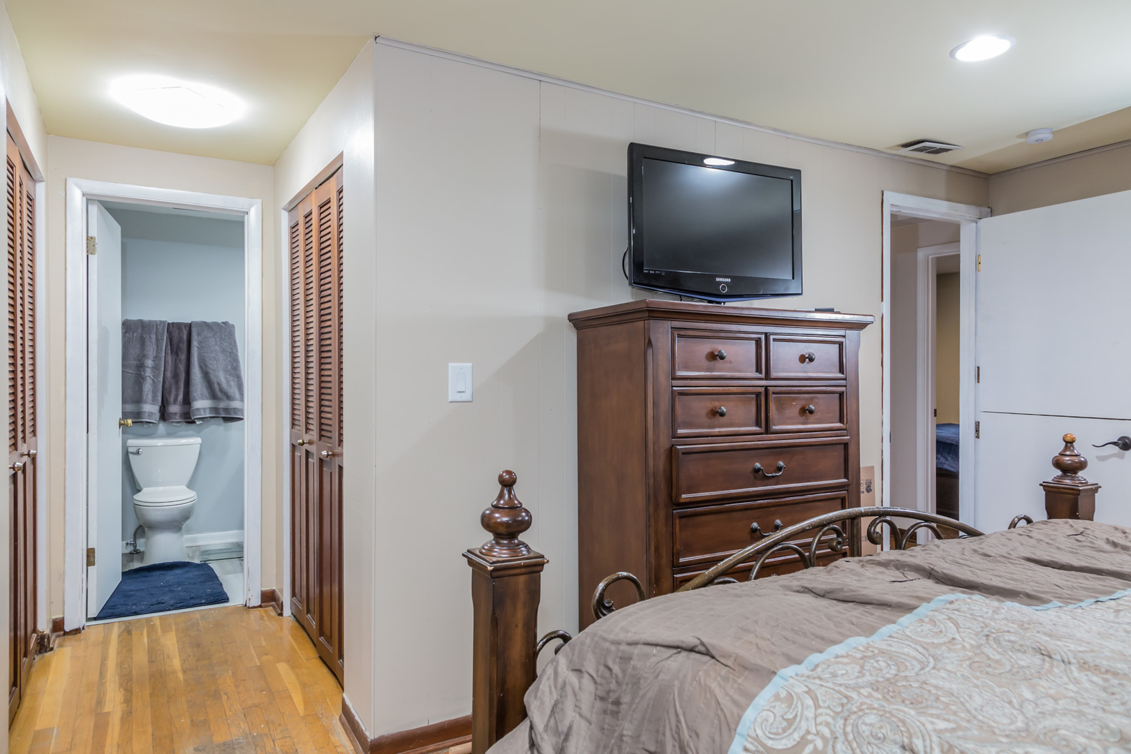 4N726 Klein Road West Chicago, IL 60185 - Photo 18 of 25 a bedroom with a bed and a flat screen tv