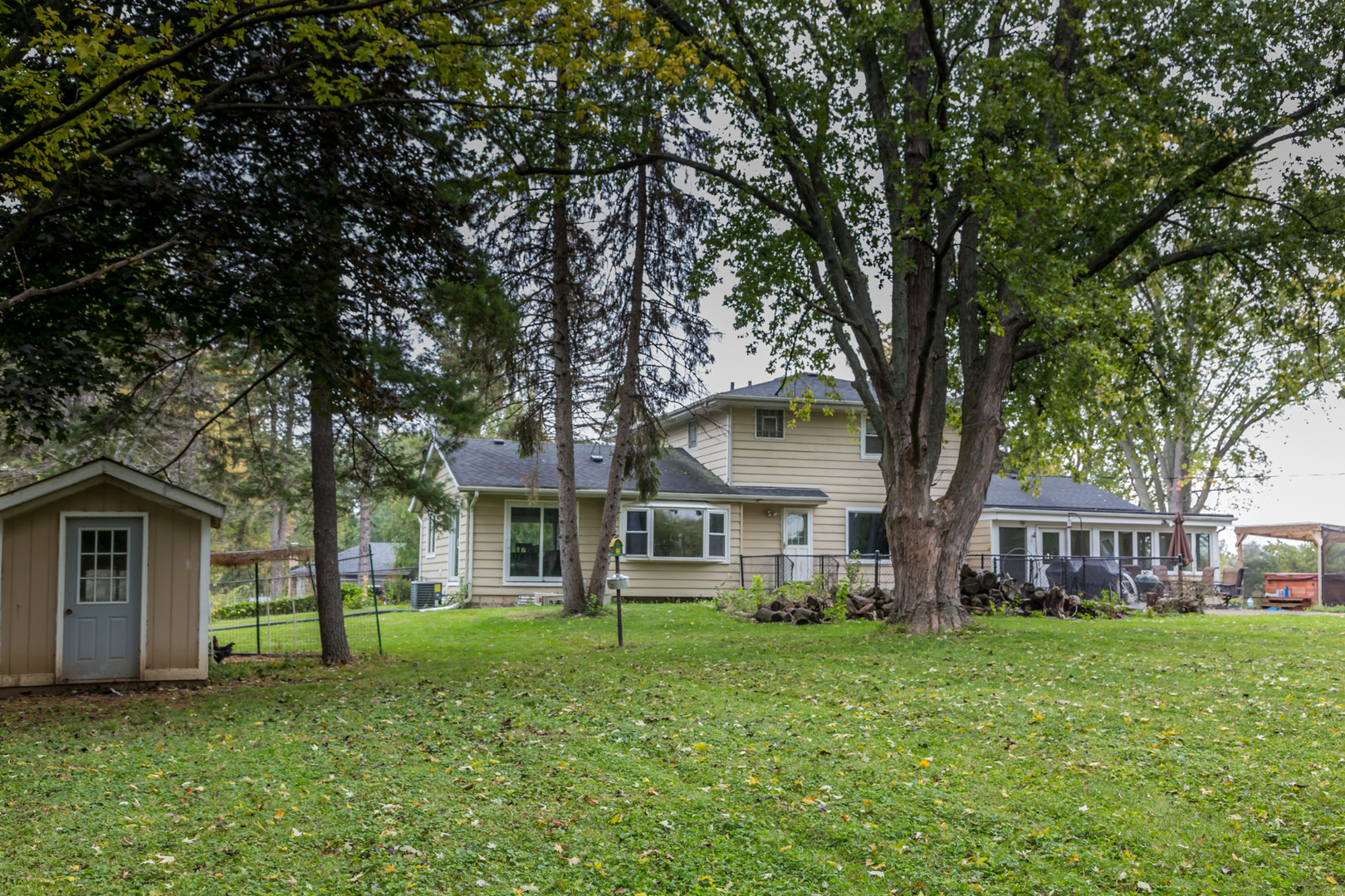 4N726 Klein Road West Chicago, IL 60185 - Photo 25 of 25 a front view of a house with a garden and trees