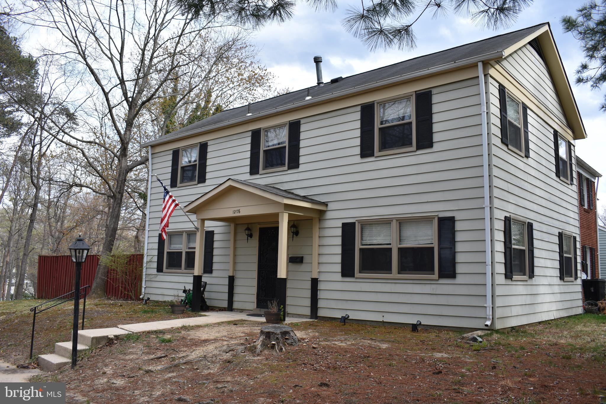 12176 Dove Circle Laurel, MD 20708 - Photo 1 of 34 a view of a house with a yard and wooden fence