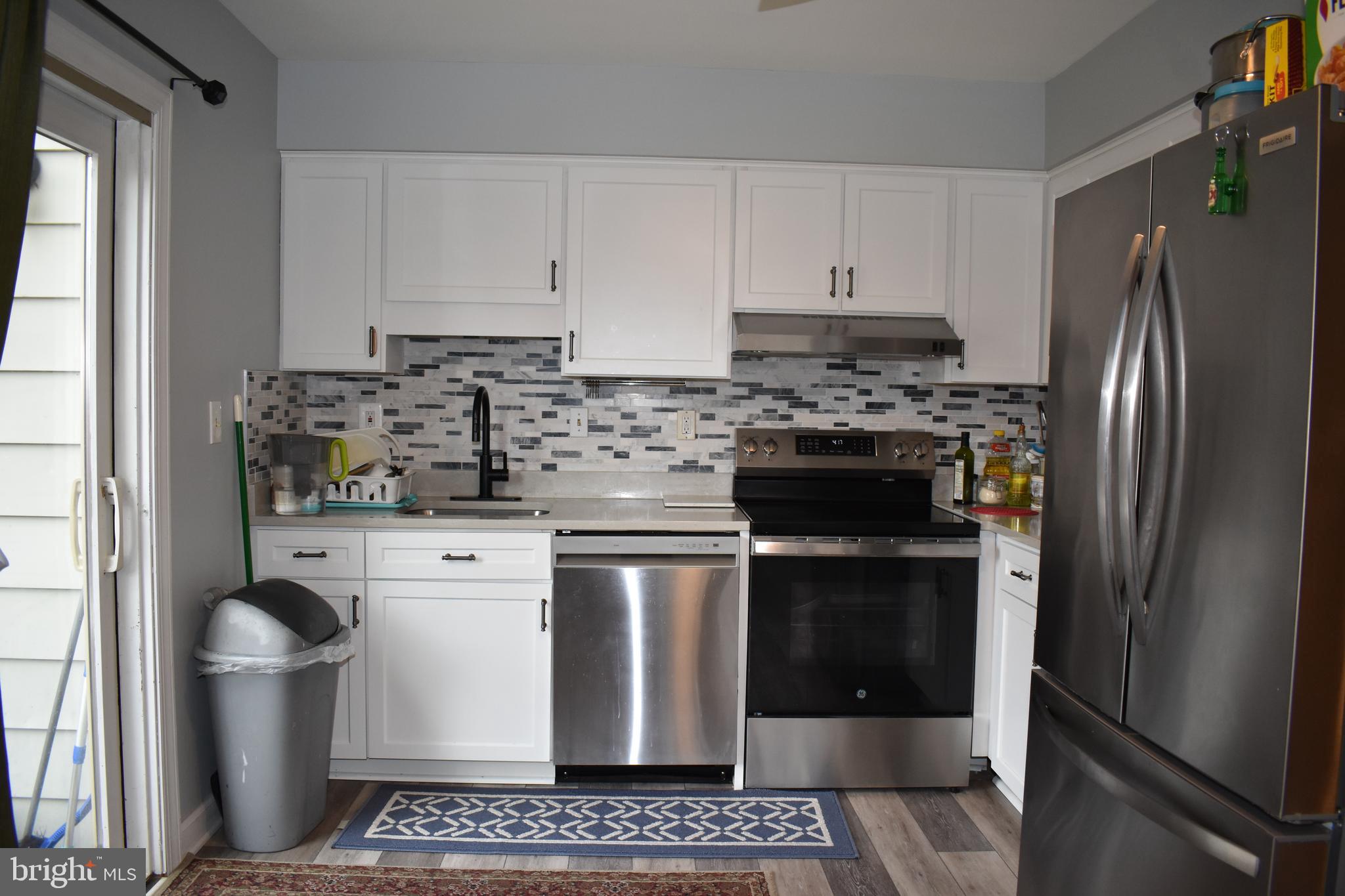 12176 Dove Circle Laurel, MD 20708 - Photo 11 of 34 a kitchen with stainless steel appliances granite countertop a stove a refrigerator and a stove