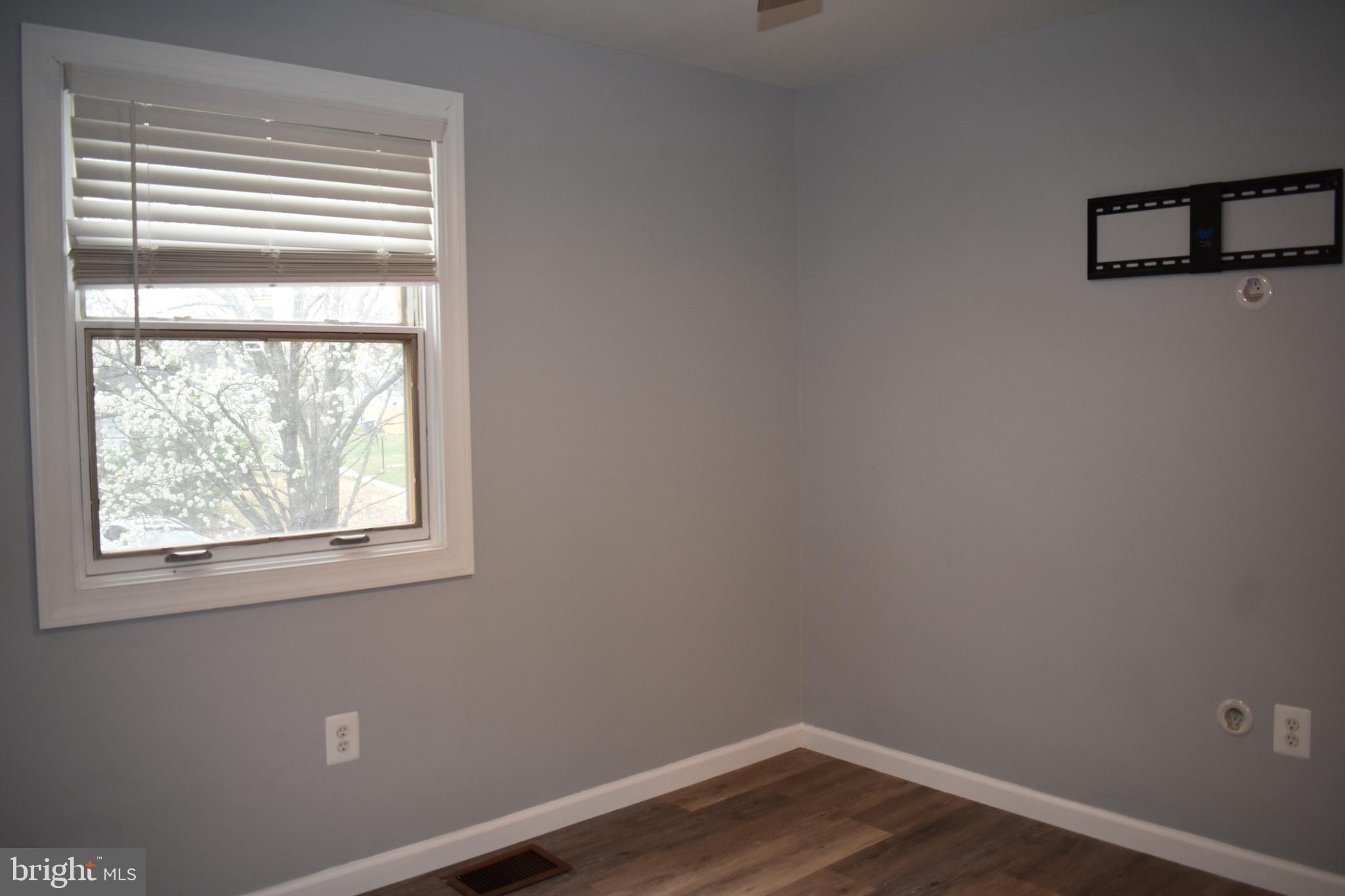 12176 Dove Circle Laurel, MD 20708 - Photo 20 of 34 a view of a small space with wooden floor and a window