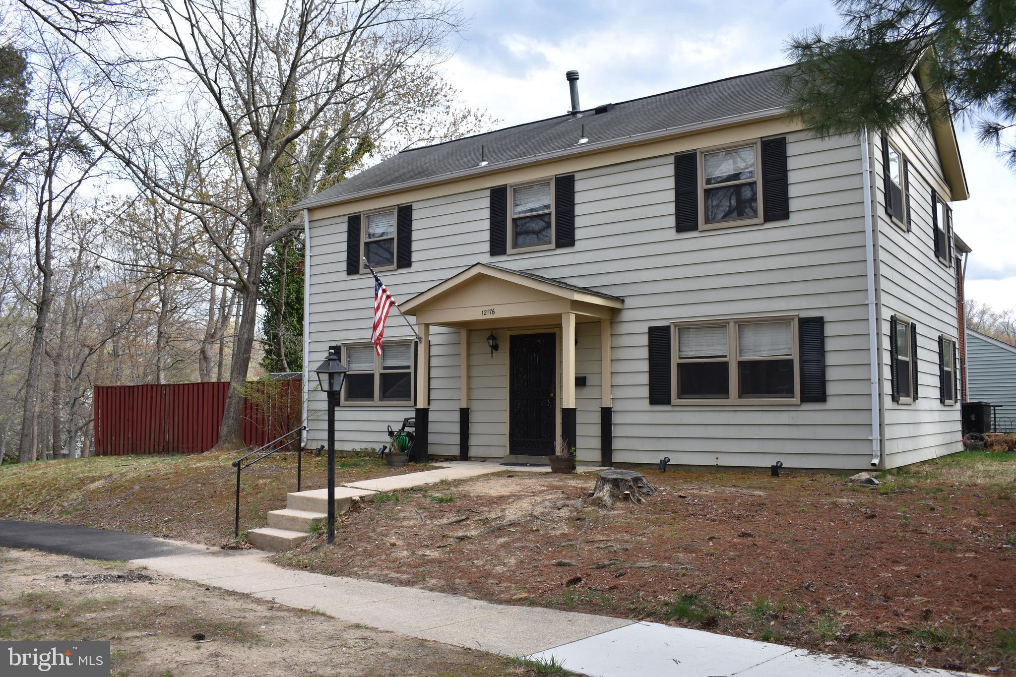 12176 Dove Circle Laurel, MD 20708 - Photo 2 of 34 a front view of a house with a yard and garage