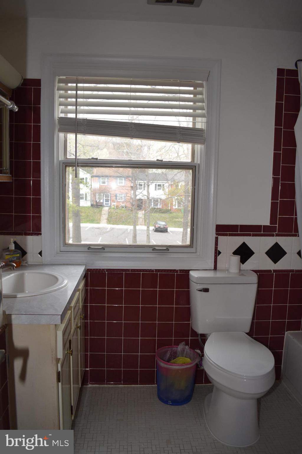 12176 Dove Circle Laurel, MD 20708 - Photo 23 of 34 a bathroom with a toilet a sink and a shower