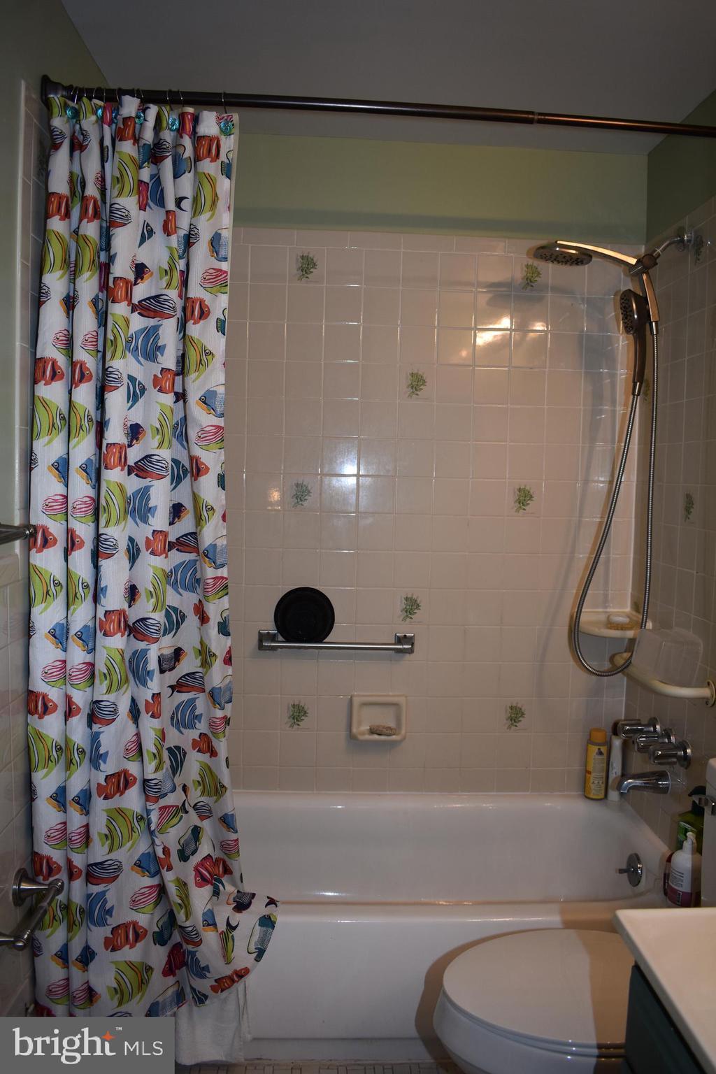 12176 Dove Circle Laurel, MD 20708 - Photo 28 of 34 a bathroom with a bathtub and shower