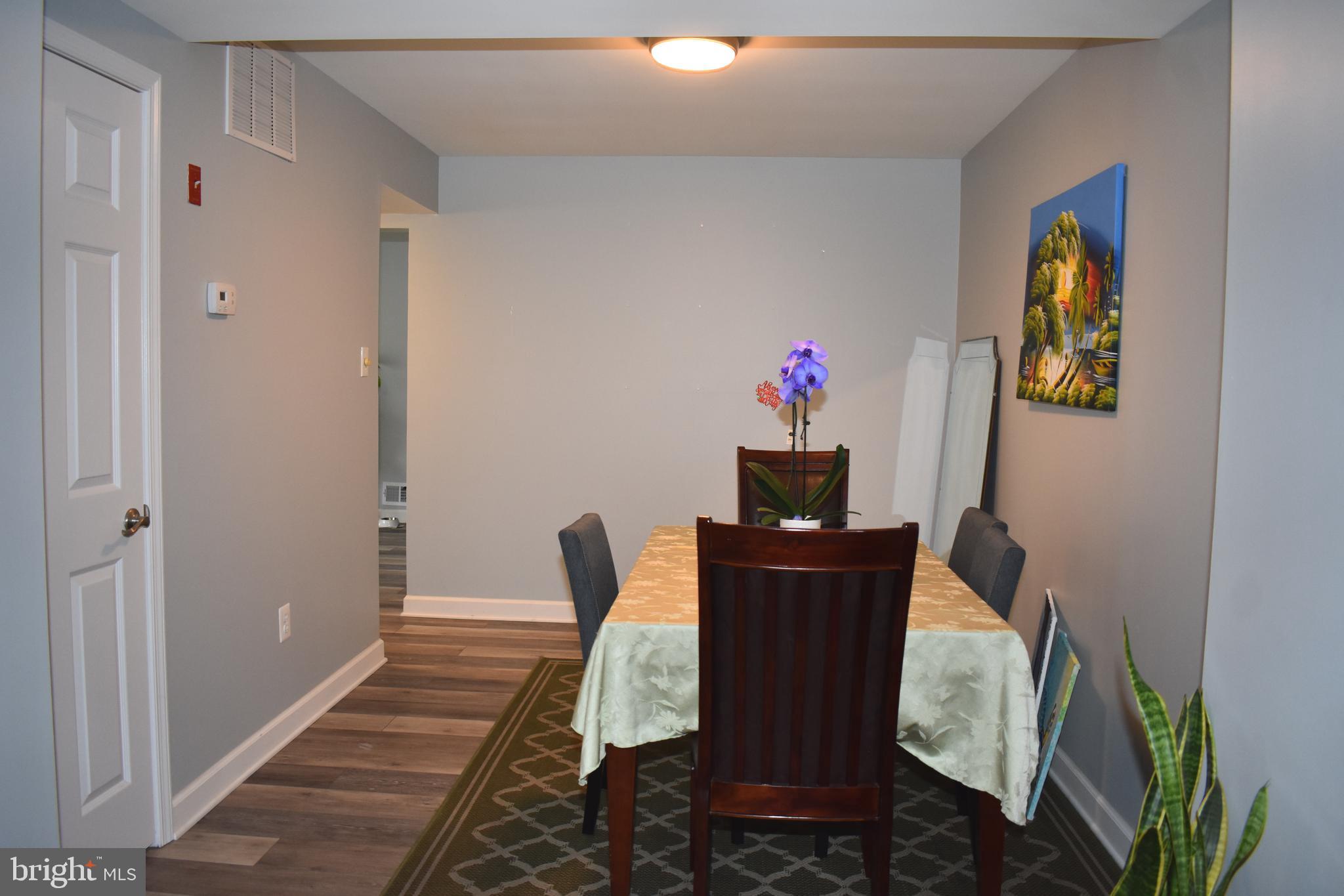 12176 Dove Circle Laurel, MD 20708 - Photo 6 of 34 a view of a workspace with furniture and wooden floor
