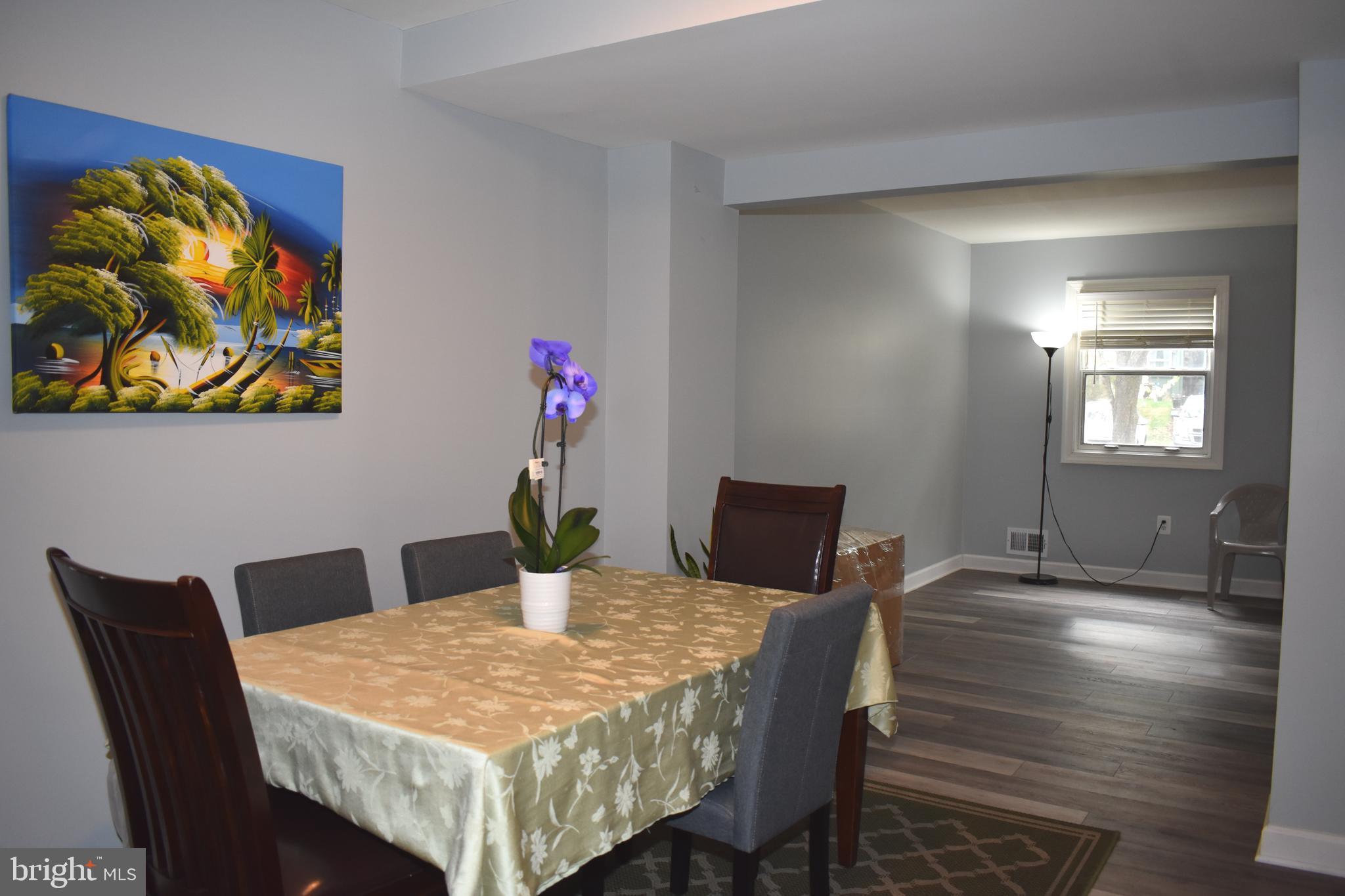 12176 Dove Circle Laurel, MD 20708 - Photo 7 of 34 a view of a dining room with furniture and wooden floor