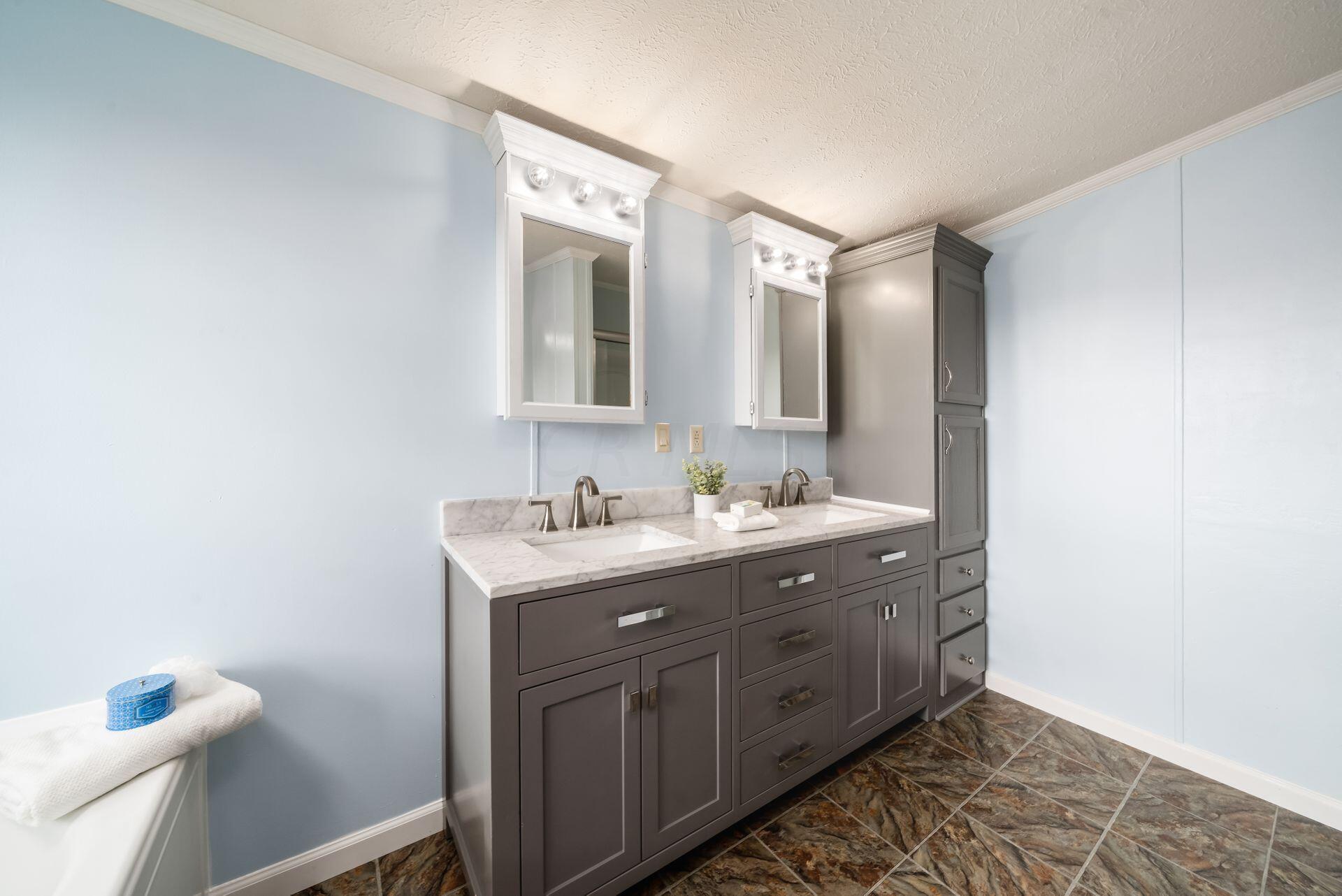 5000 Leonardsburg Road Delaware, OH 43015 - Photo 19 of 40 Remodeled w/Dual Sink Vanity, Granite Countertop, Faucets, and Large Cabinet, and Vinyl Flooring (2021-2022)