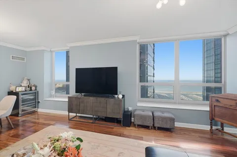 a living room with furniture and a flat screen tv