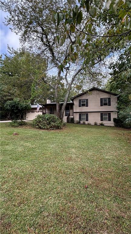 a view of a house with a big yard