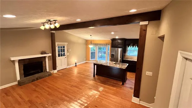 a lobby with furniture and chandelier