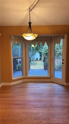 a view of swimming pool with a table and chairs