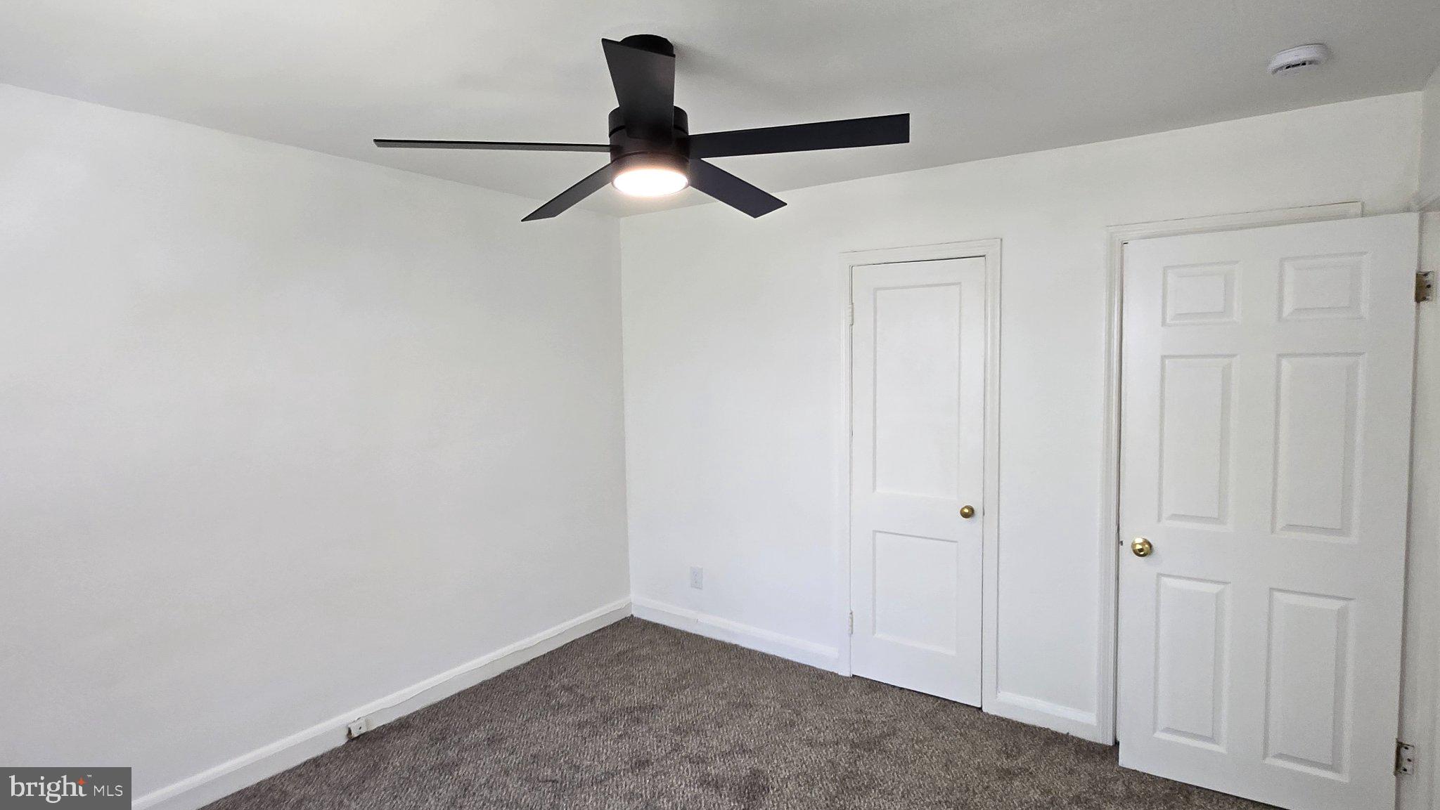 3820 Elkader Road Baltimore, MD 21218 - Photo 28 of 41 Bright and airy room with modern fan.