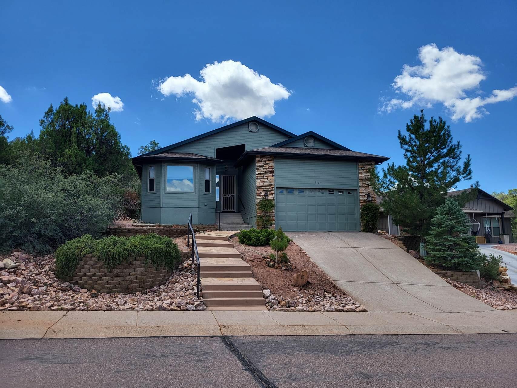 1120 South Sycamore Circle Payson, AZ 85541 - Photo 1 of 44 a front view of a house with a garden