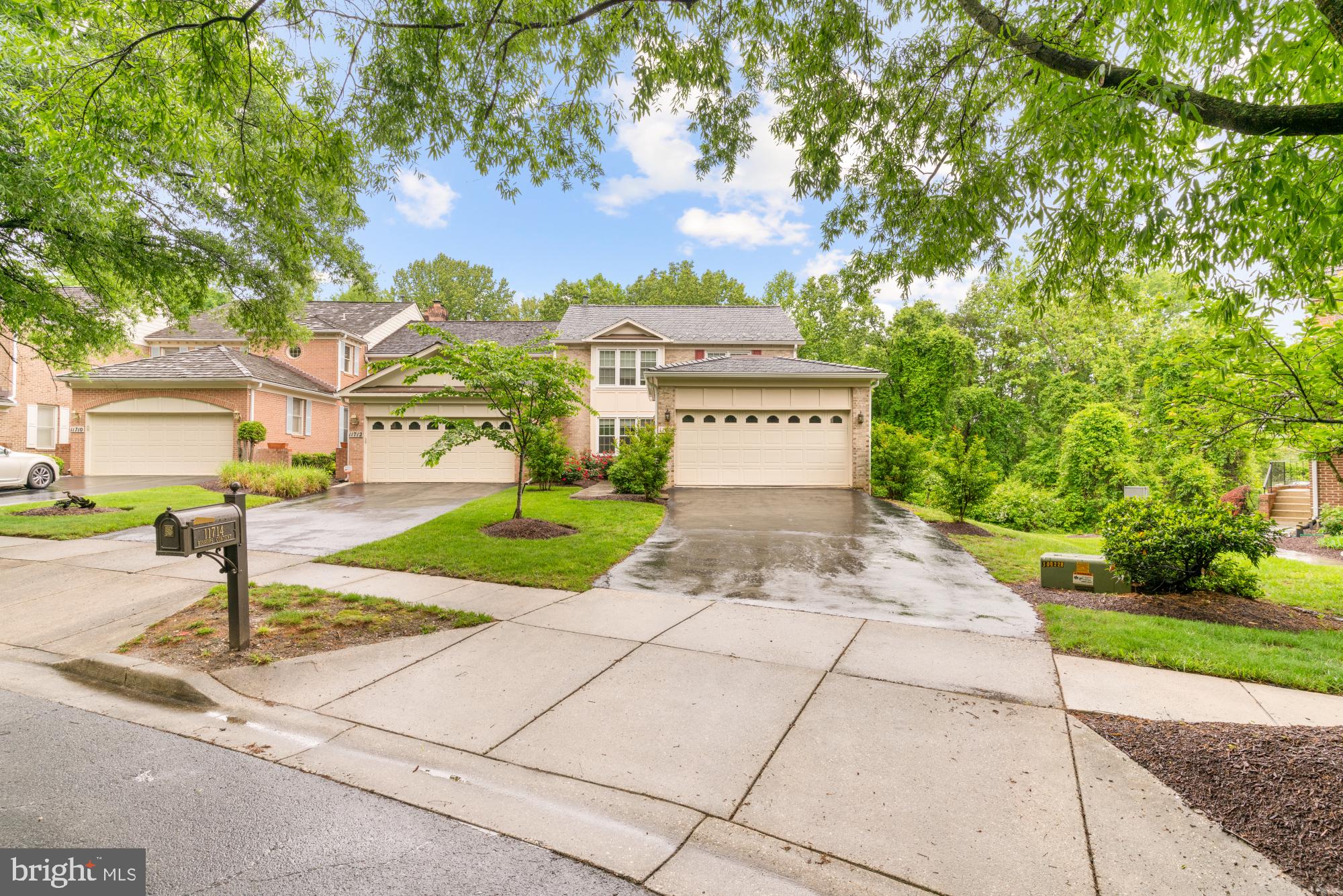 a sign board with buildings in the background