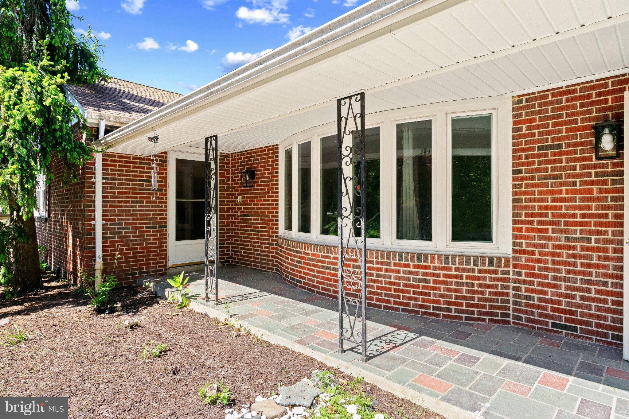 5422 Woodbine Road Woodbine, MD 21797 - Photo 1 of 39 Charming brick entryway with greenery.