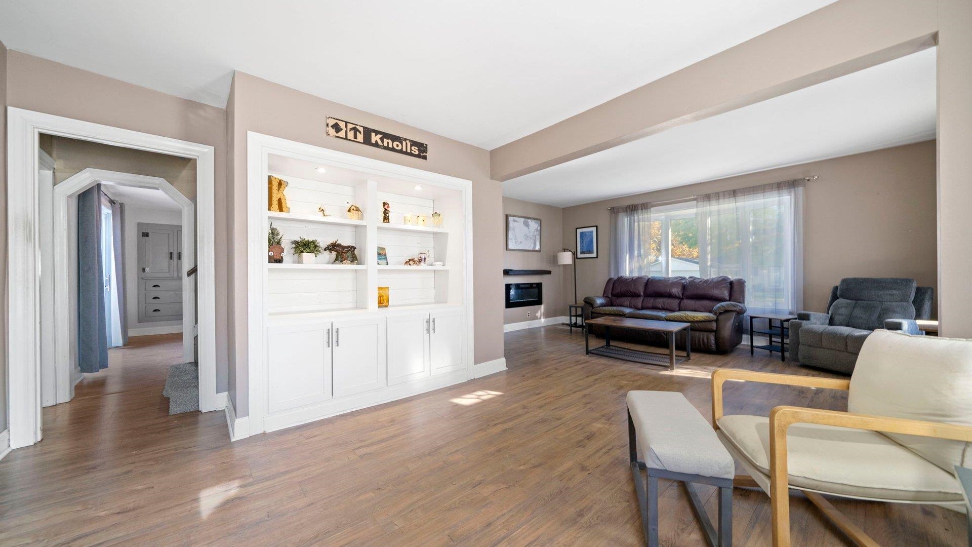401 West 3rd Street Byron, IL 61010 - Photo 12 of 43 a view of livingroom with furniture and wooden floor