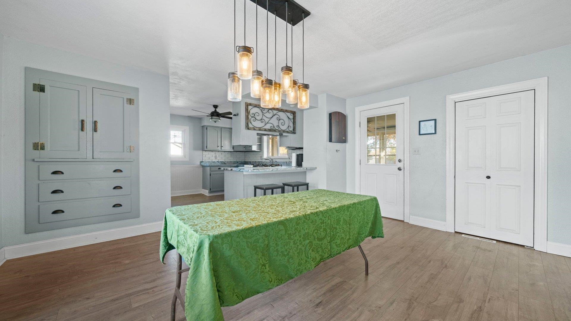 401 West 3rd Street Byron, IL 61010 - Photo 15 of 43 a living room with table and chairs