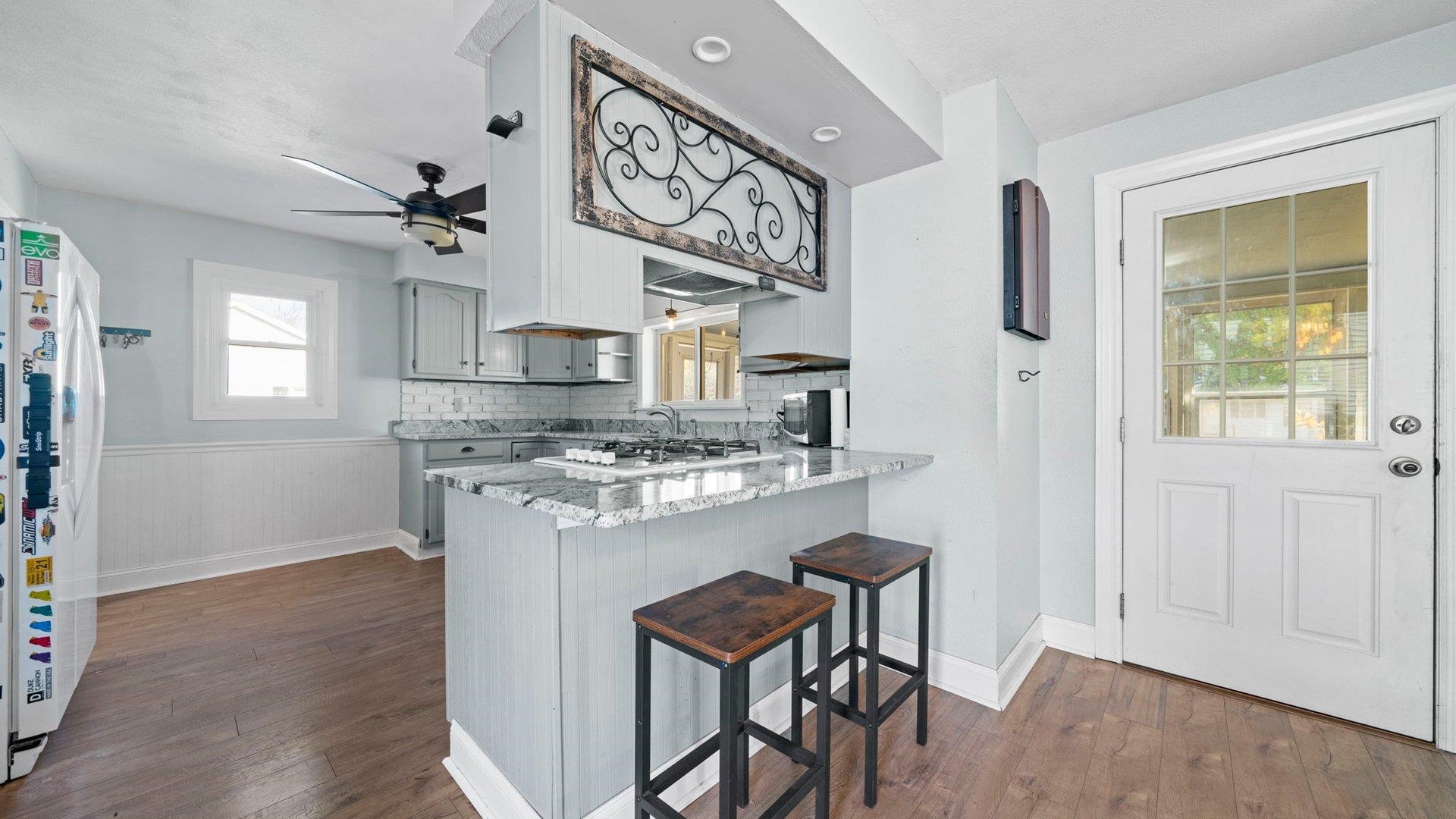 401 West 3rd Street Byron, IL 61010 - Photo 19 of 43 a kitchen with stainless steel appliances granite countertop a sink and cabinets