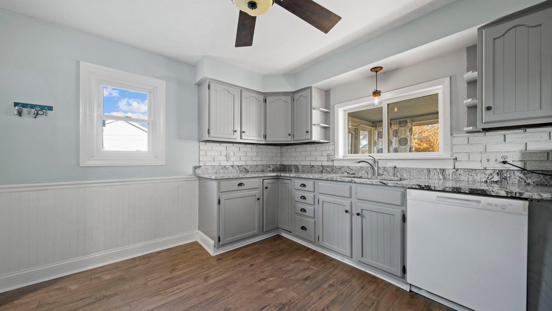 401 West 3rd Street Byron, IL 61010 - Photo 20 of 43 a kitchen with sink cabinets and window