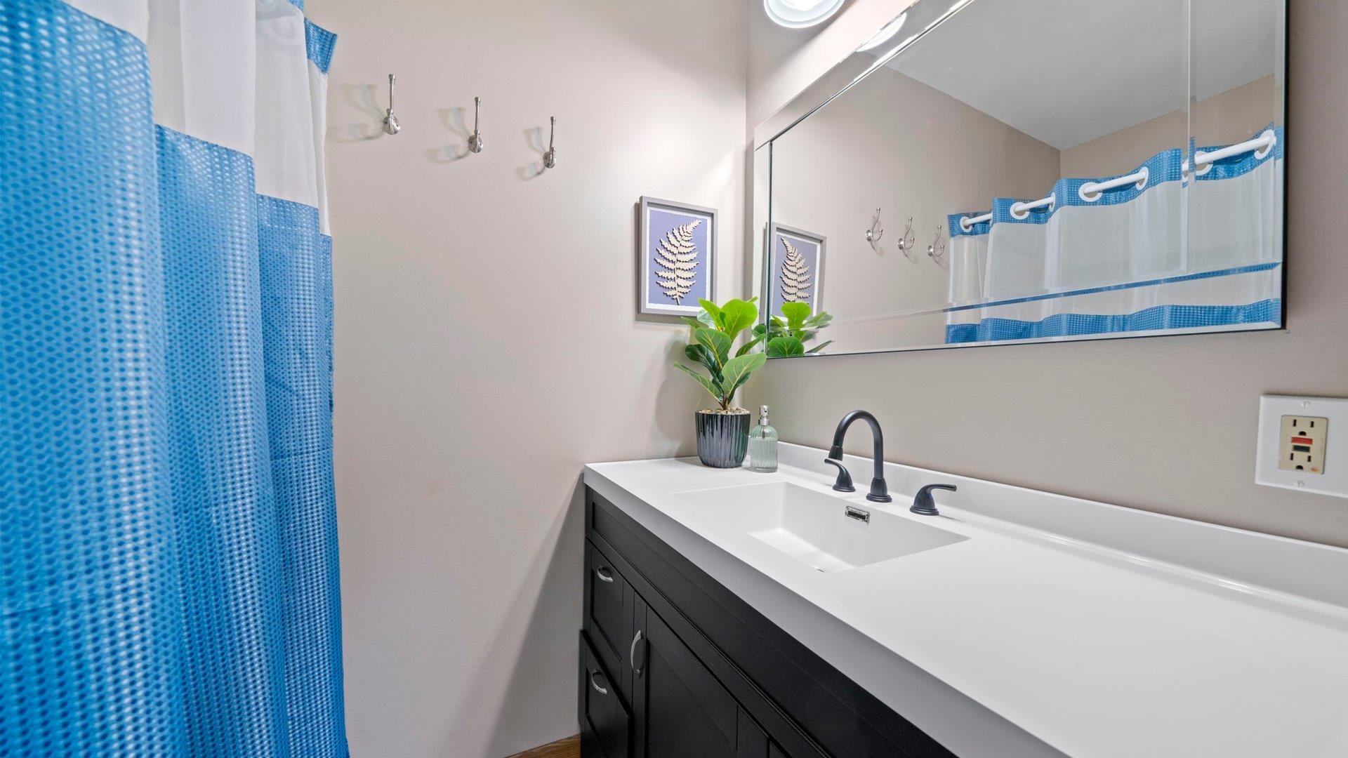 401 West 3rd Street Byron, IL 61010 - Photo 23 of 43 a bathroom with a sink and a mirror
