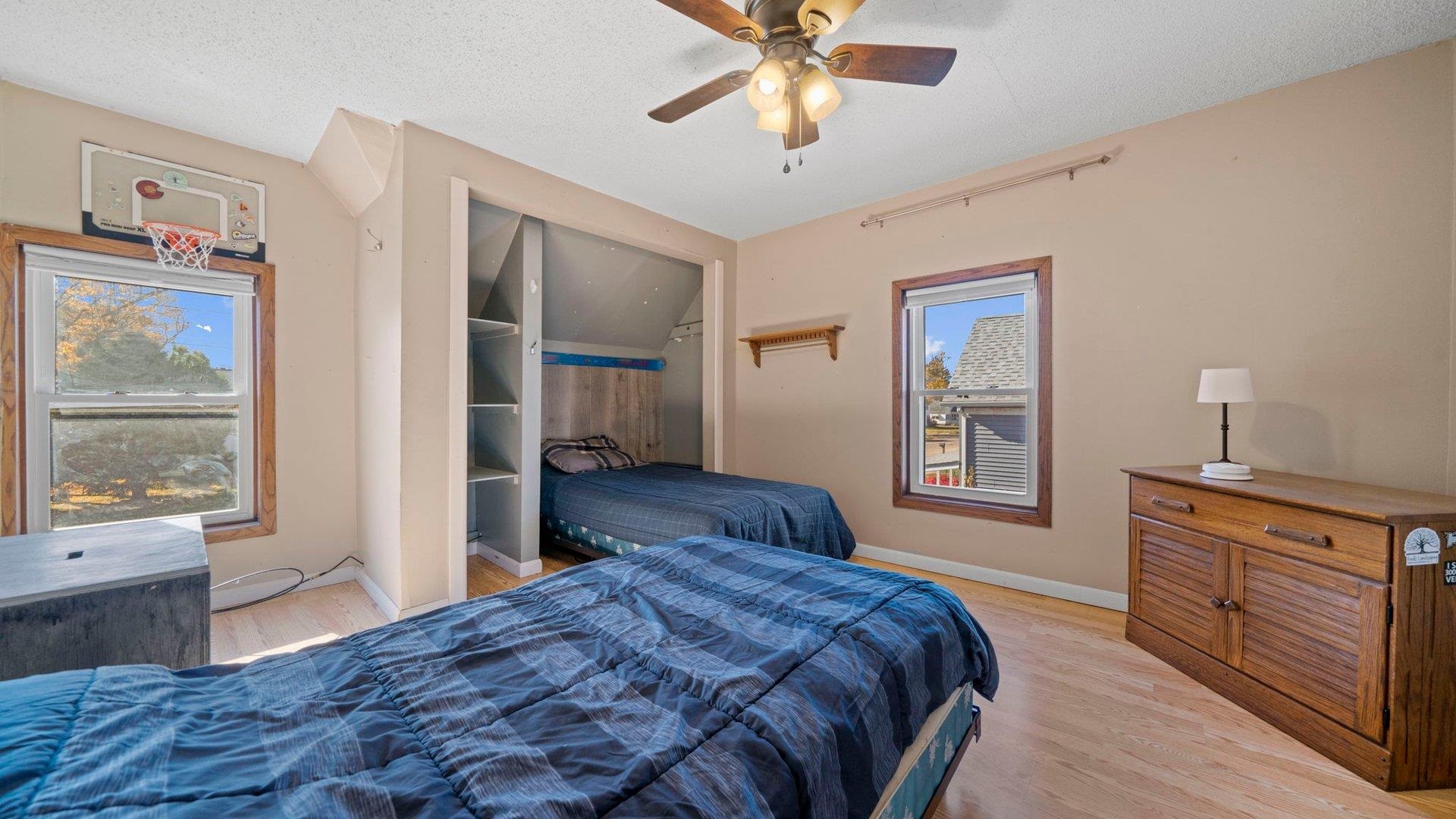 401 West 3rd Street Byron, IL 61010 - Photo 26 of 43 a bedroom with a bed and a dresser next to a window