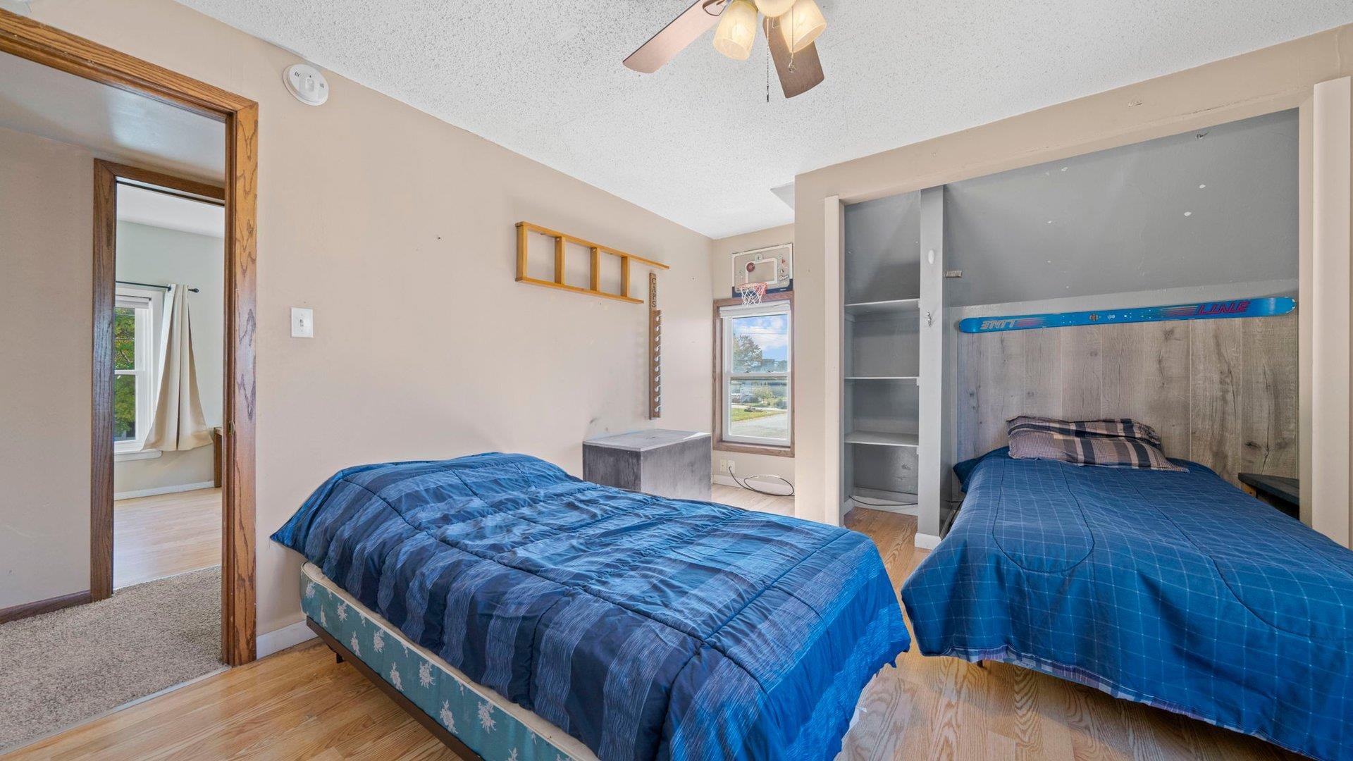 401 West 3rd Street Byron, IL 61010 - Photo 27 of 43 a bedroom with a bed and a view of closet