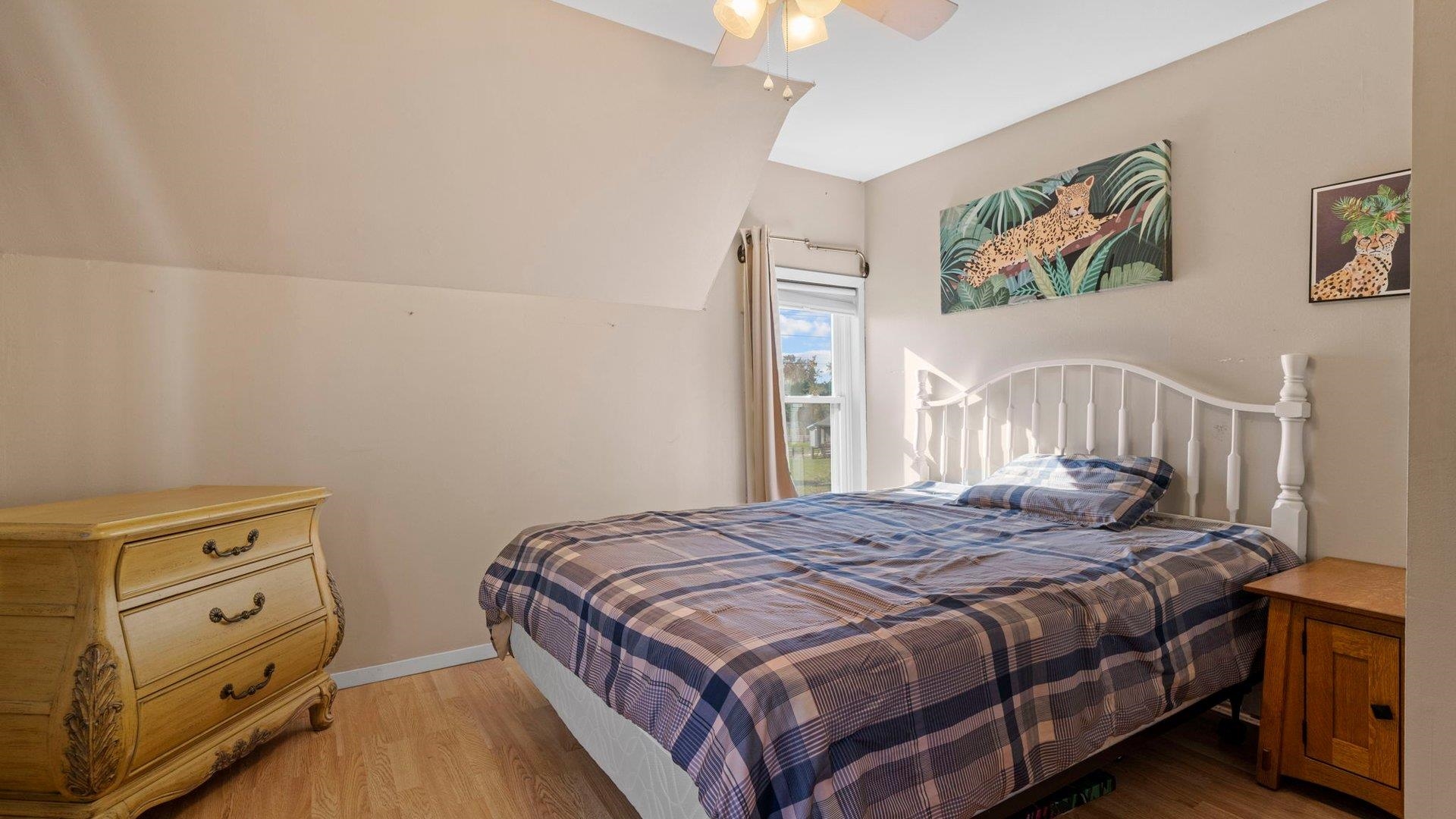 401 West 3rd Street Byron, IL 61010 - Photo 29 of 43 a bedroom with a bed and a window