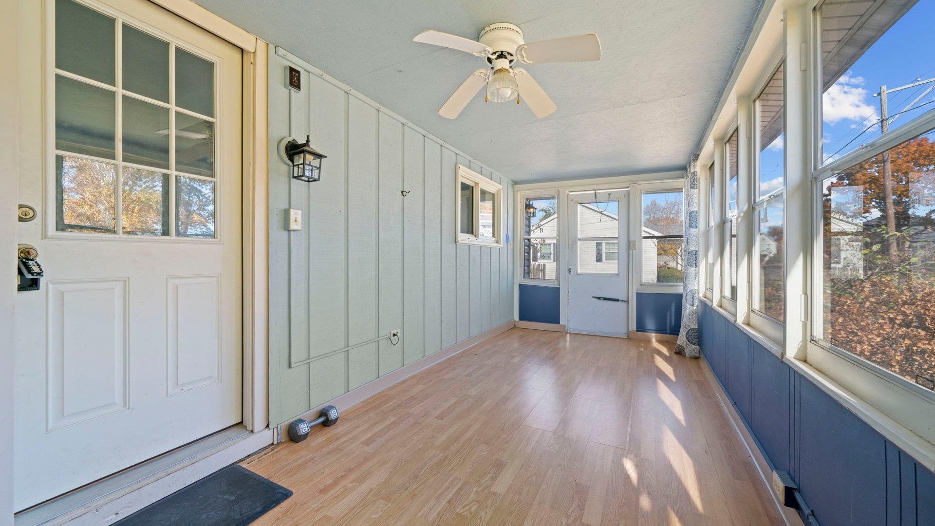401 West 3rd Street Byron, IL 61010 - Photo 30 of 43 a view of a big room with windows and chandelier fan