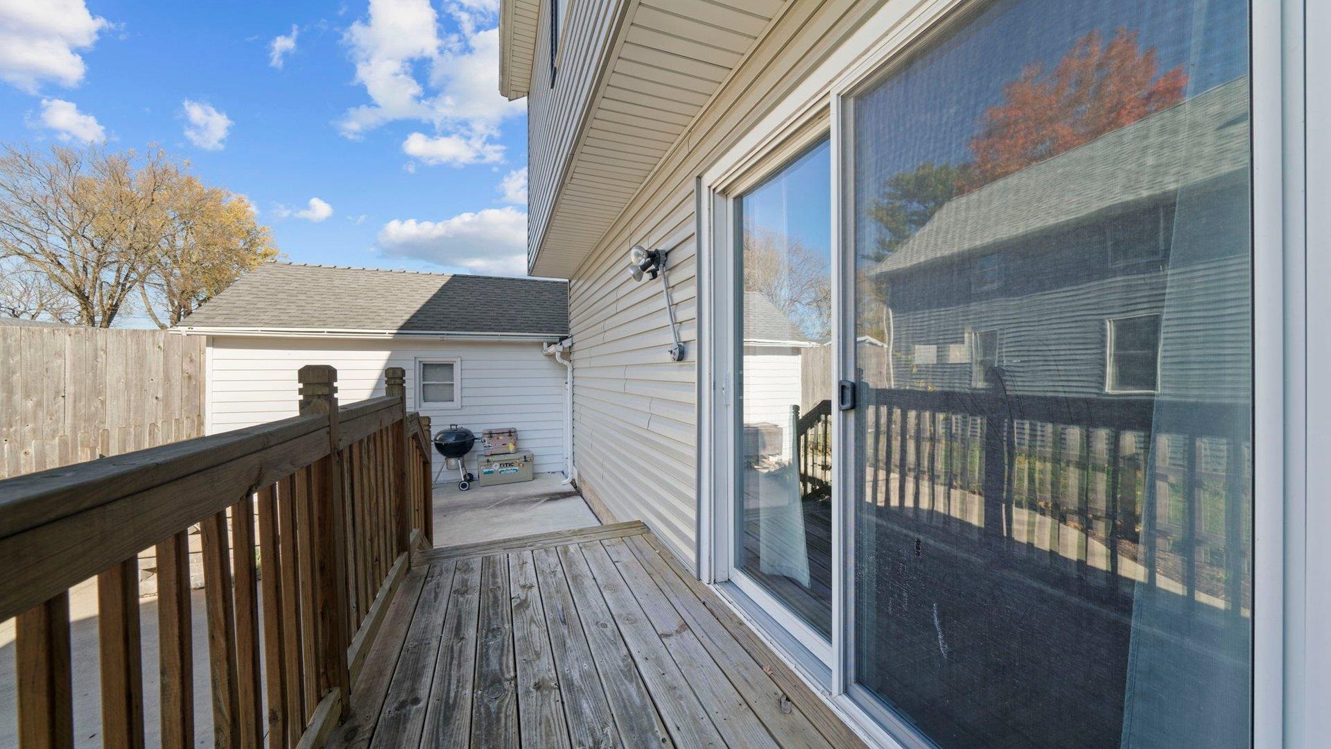 401 West 3rd Street Byron, IL 61010 - Photo 32 of 43 a view of a balcony with wooden floor