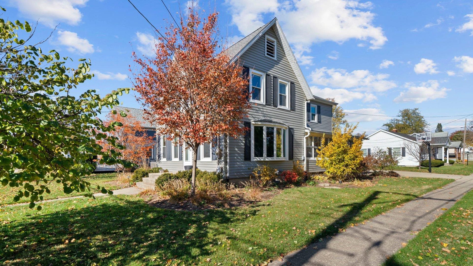 401 West 3rd Street Byron, IL 61010 - Photo 37 of 43 a front view of a house with a yard