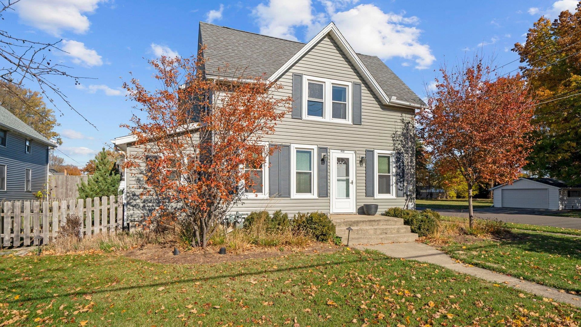 401 West 3rd Street Byron, IL 61010 - Photo 38 of 43 a front view of a house with a yard