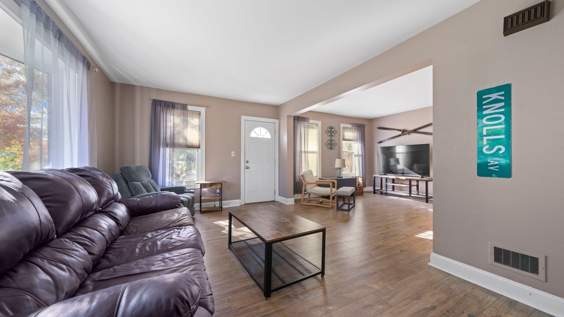 401 West 3rd Street Byron, IL 61010 - Photo 4 of 43 a living room with furniture and wooden floor