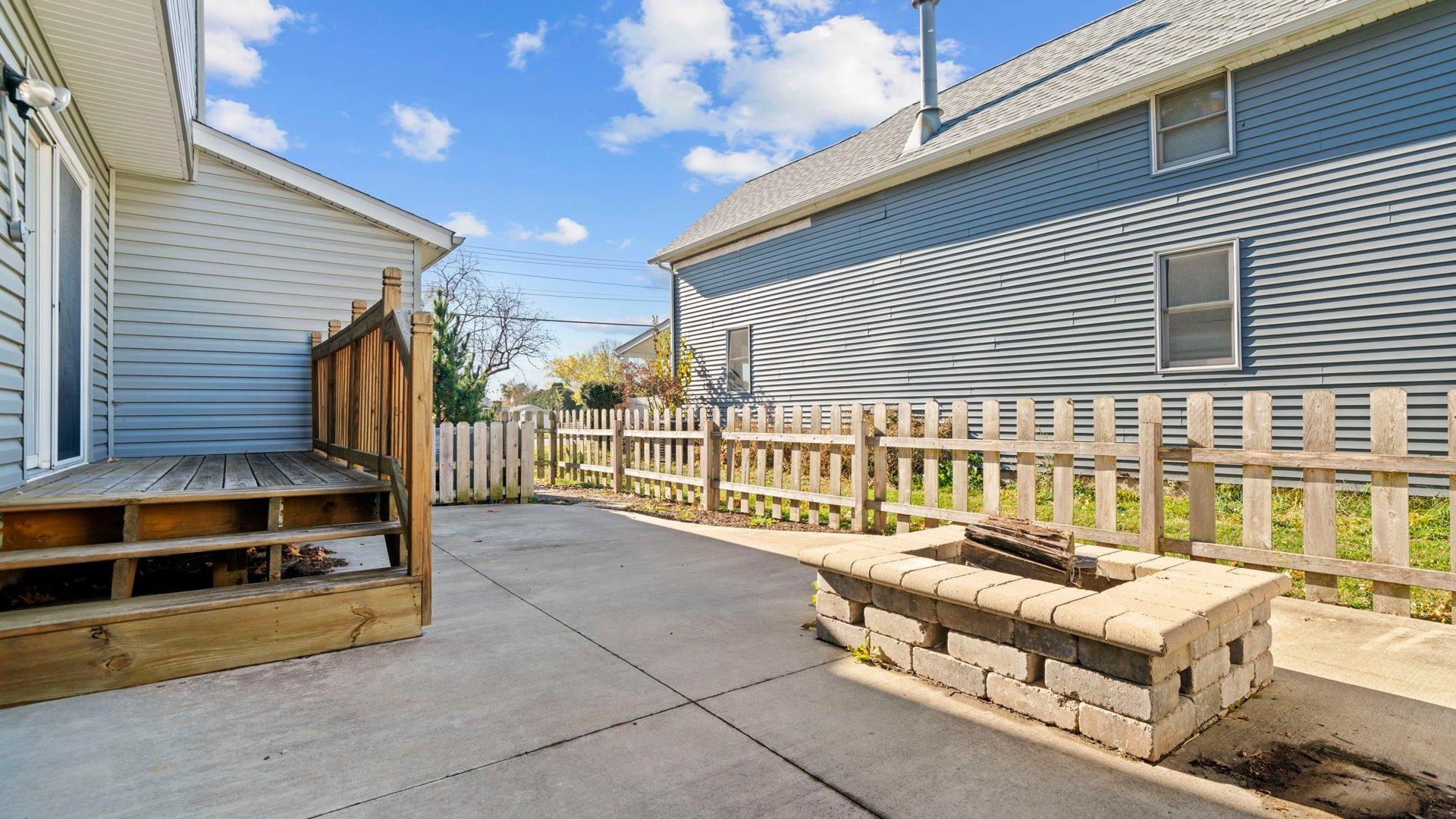 401 West 3rd Street Byron, IL 61010 - Photo 5 of 43 a view of a patio with a table and chairs