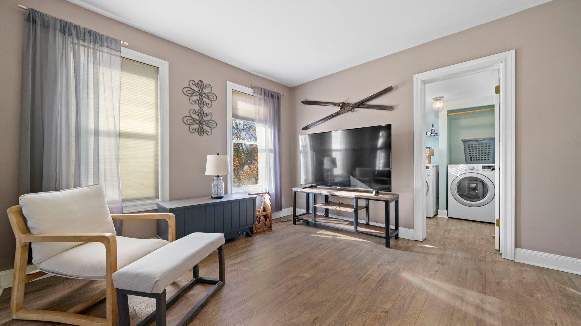 401 West 3rd Street Byron, IL 61010 - Photo 10 of 43 a living room with furniture and a flat screen tv