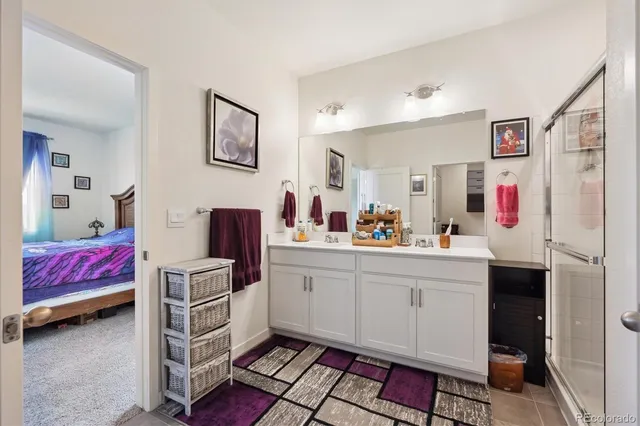 a bathroom with a sink and a shower