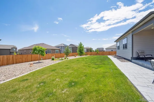 swimming pool view with a garden space