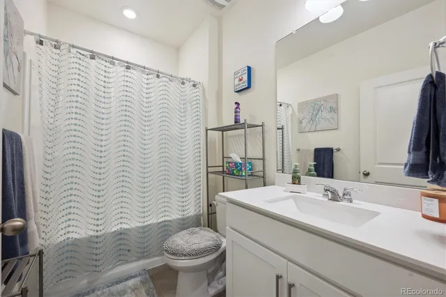 a bed room with a bed window and a table