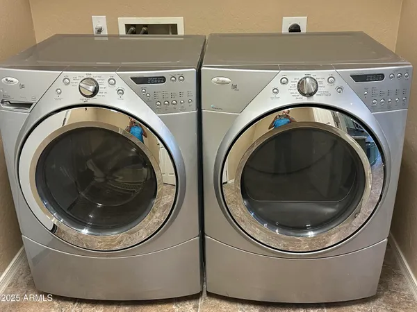 a utility room with dryer and washer