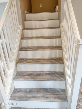 a view of staircase with white walls