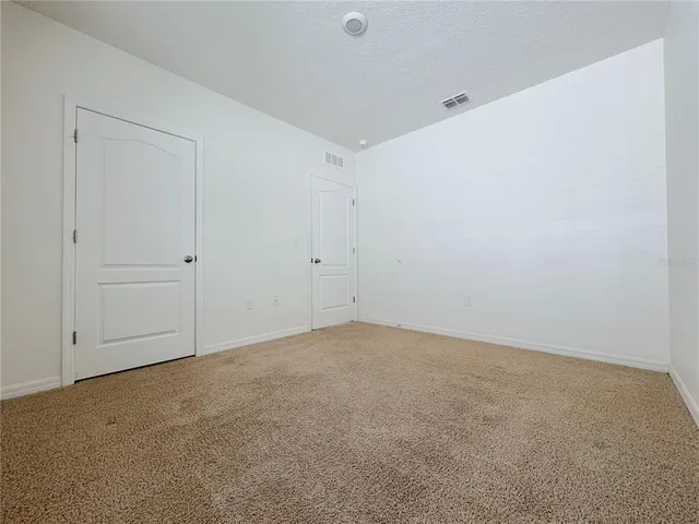 a kitchen with stainless steel appliances granite countertop a sink refrigerator and microwave