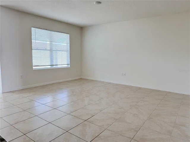 a bathroom with a granite countertop sink a mirror and a shower