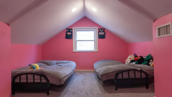 a view of backyard with deck and seating space