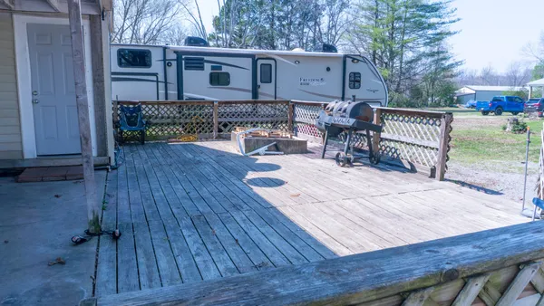 a front view of house with a yard