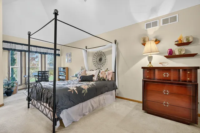 a bedroom with furniture and a window