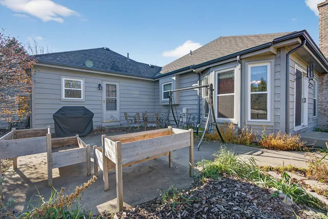 a backyard of a house with yard and outdoor seating