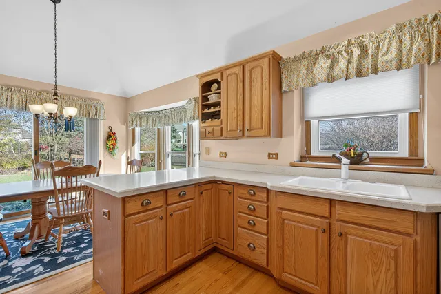 a kitchen with a sink and cabinets