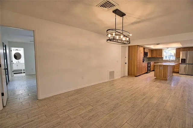 a view of a dining room with wooden floor