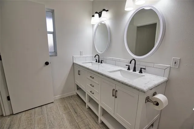 a bathroom with a sink and a mirror
