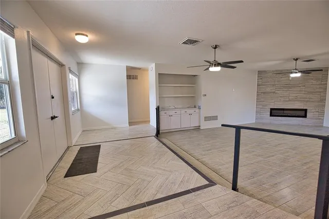 a view of a hallway view with staircase