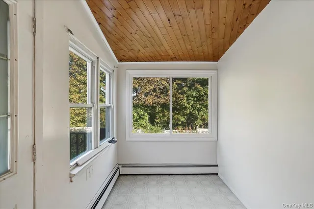 a kitchen with a refrigerator and a sink